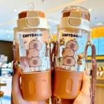 580ml Tritan Cute Capybara Space Cup with Hand-held Ring BPA-Free Portable Camper Water Bottle with Straw and Strap Juice Cup